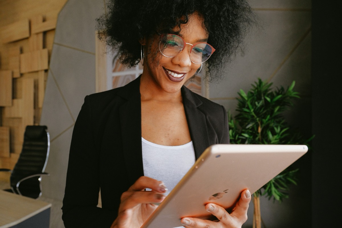 Woman-inspecting-property-with-mobile-tablet